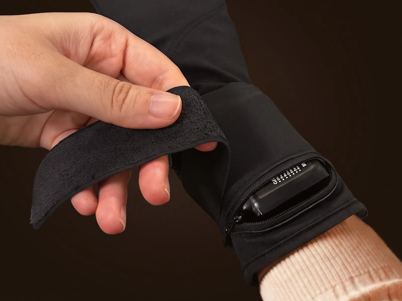 The battery pod clicked onto the back of the hand, held by its strap
